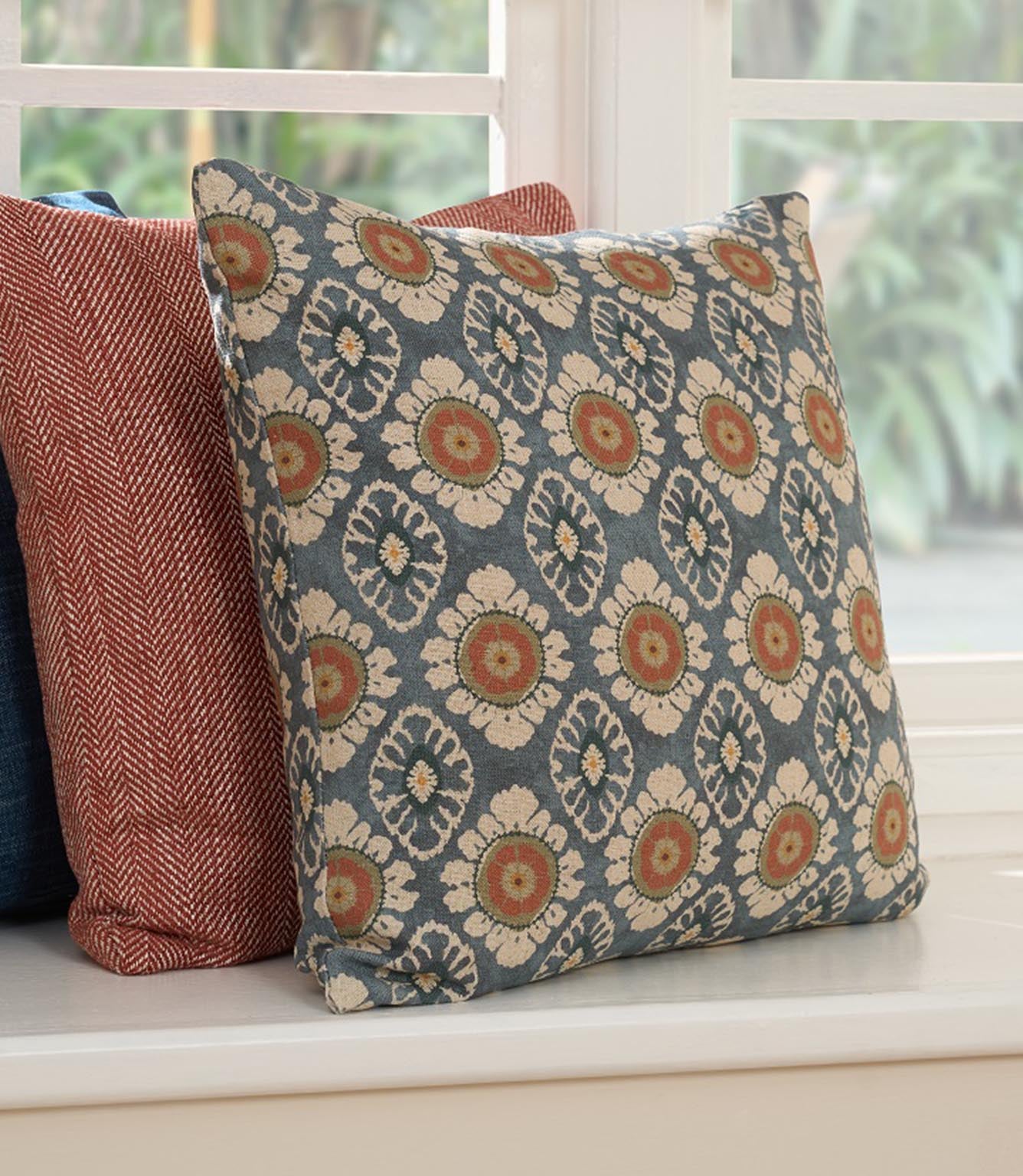 Maya designer fabric cushion with small scale floral pattern, shown with coordinating roman blind, suitable for curtains blinds cushions and upholstery