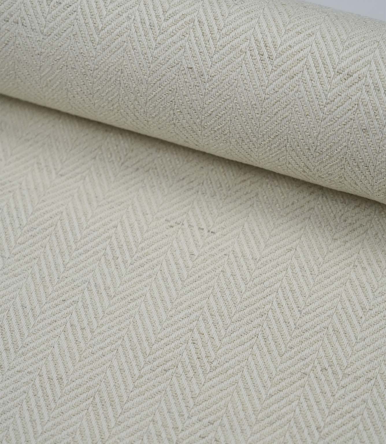 Wide view of Bampton Jasmine woven herringbone fabric showcasing the continuous classic pattern.