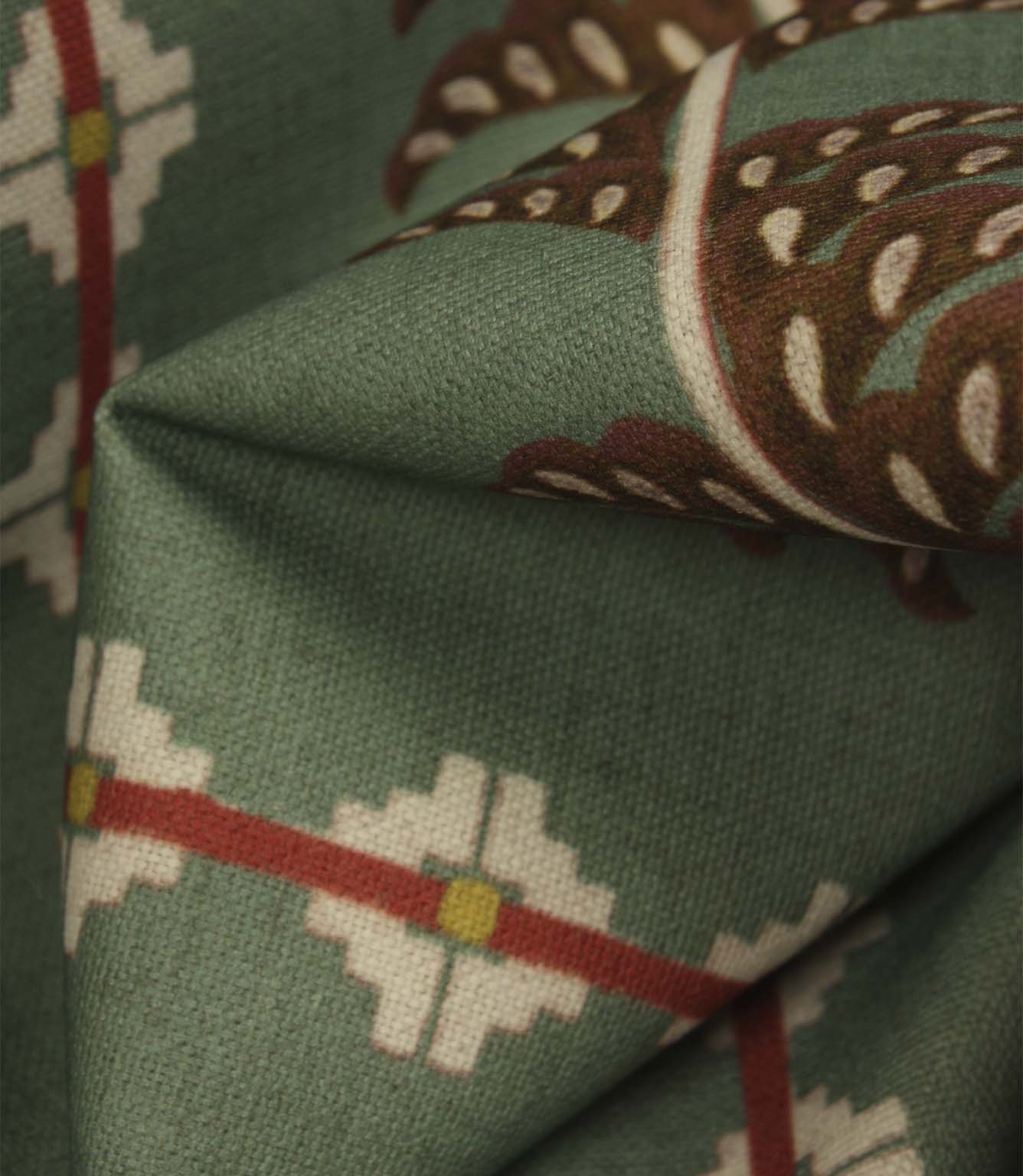 Detailed close-up of Boho Trail Mineral fabric featuring terracotta botanical stripes, geometric motifs and a soft mineral green background.