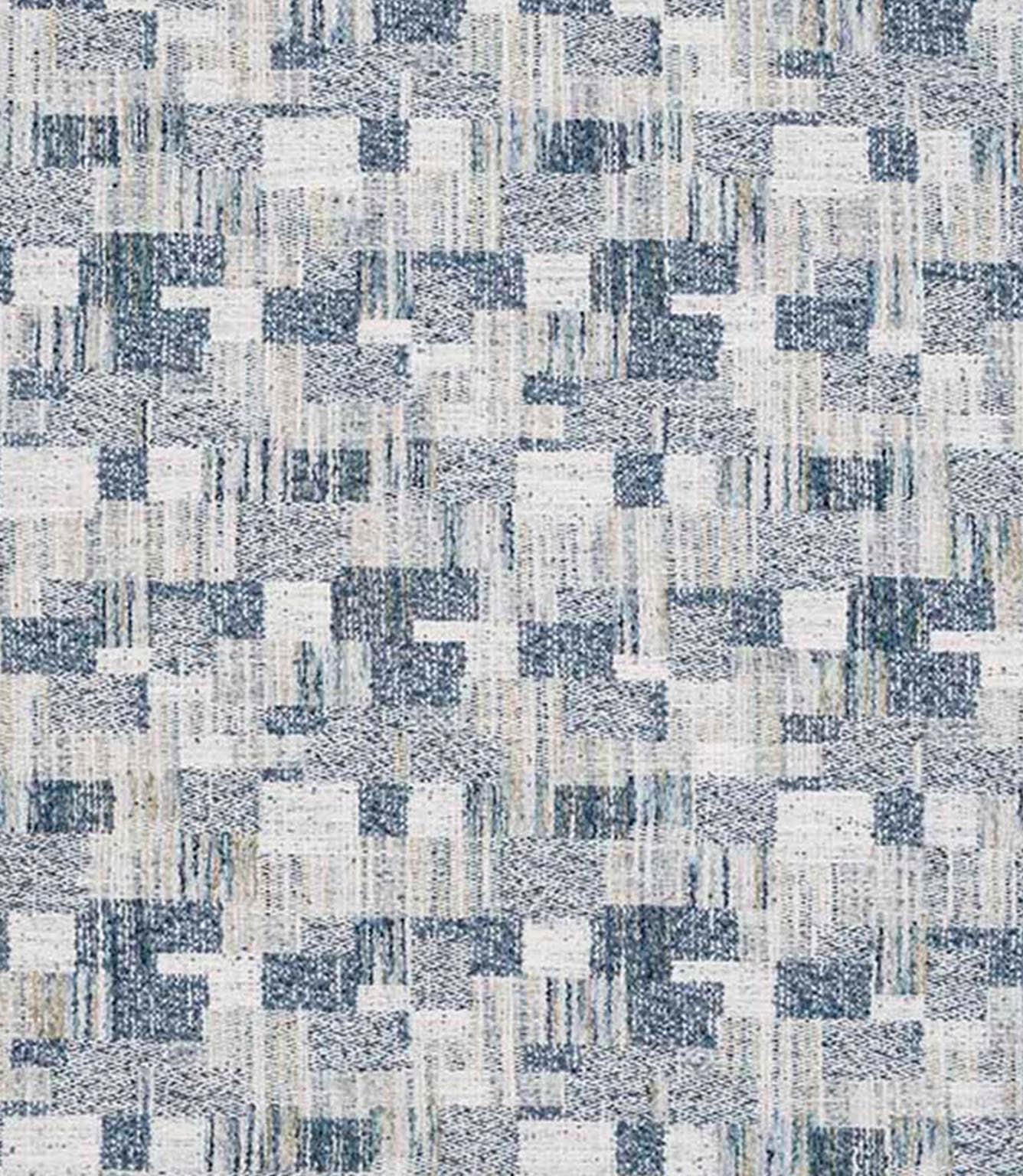 Close-up of woven geometric fabric with an abstract check pattern in soft blue, grey and off-white tones, featuring a textured, layered weave.