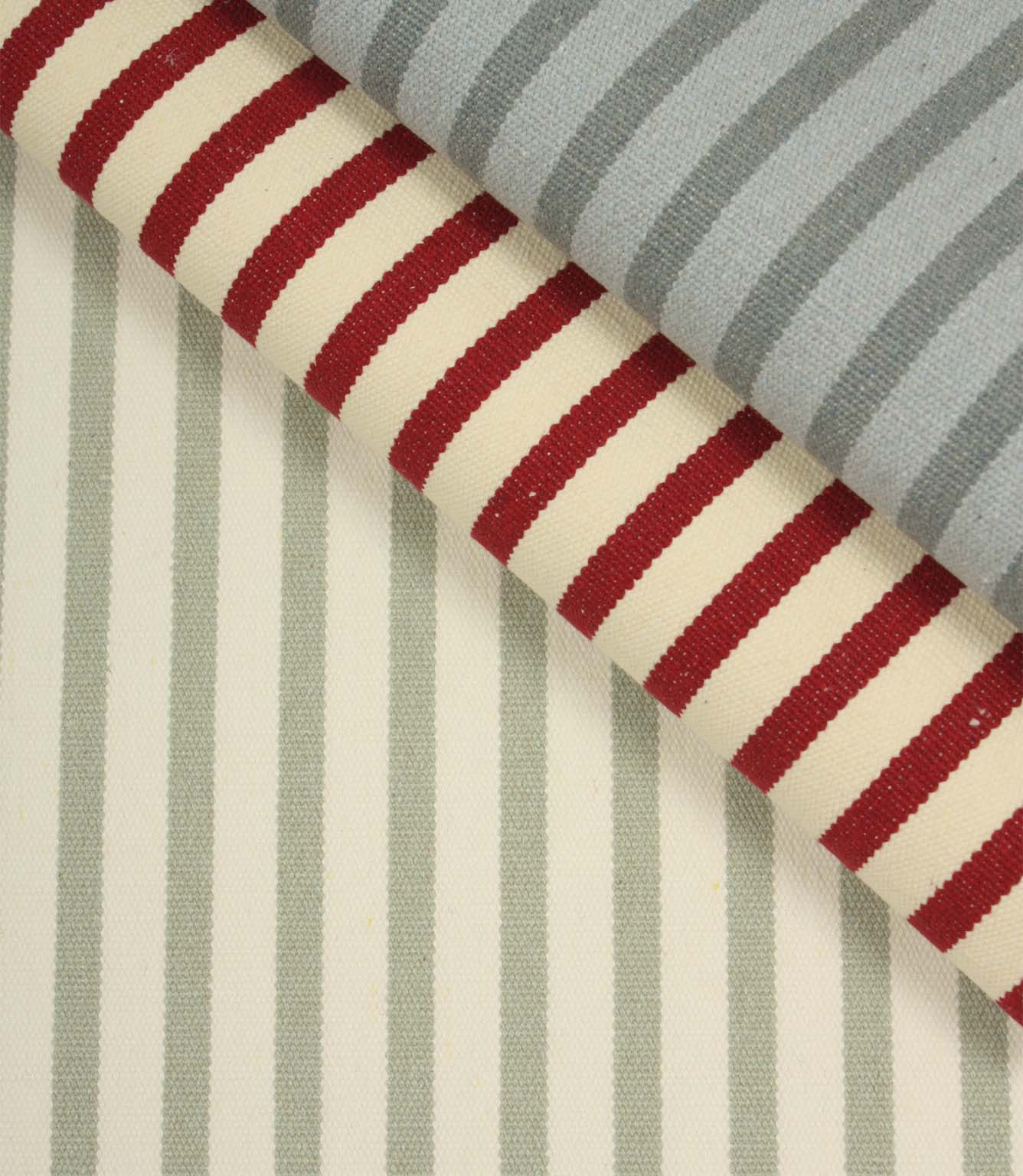 Fernley Stripe sage green striped upholstery fabric displayed alongside coordinating red and blue stripe fabrics, highlighting complementary woven stripe colourways.