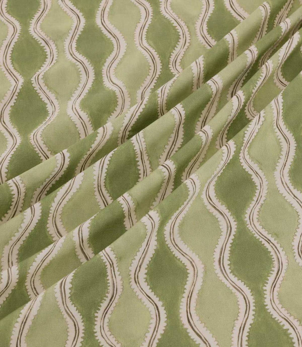 Wading Kelp fabric arranged in soft diagonal folds, showcasing its contemporary wave-inspired stripe design in sage and olive green, with cream scalloped detailing and fine taupe outlines highlighting the fabric's texture and drape.