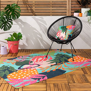 Use an outdoor rug to anchor your theme: