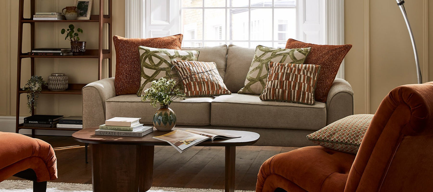 Upholstery fabric cushions on a sofa in a styled living room