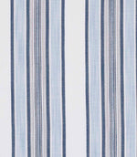 Fabric with a combination of blue, white and neutral vertical stripes in varied patterns and textures.
