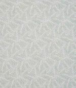 Detailed view of leaf-patterned woven fabric in muted green and off-white tones, showing an intricate foliage motif with a subtle tactile finish.