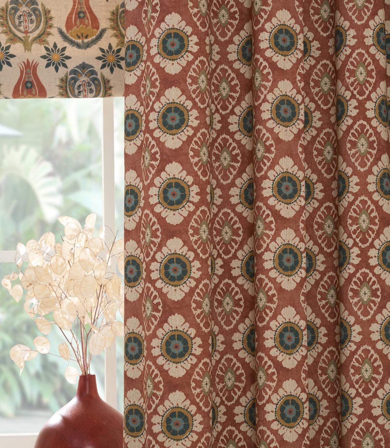 Close up of Maya designer fabric curtains showing small scale floral pattern and soft drape for interior furnishings
