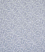 Detailed view of leaf-patterned woven fabric in muted blue and off-white shades, showing a layered foliage design with a gentle, textured finish.