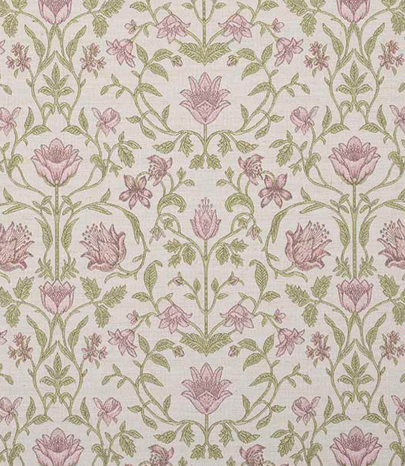 Close-up fabric view with vibrant coral pink floral motifs, soft green foliage and neutral accents on a light natural background, highlighting the richness of the pattern and colour contrast.
