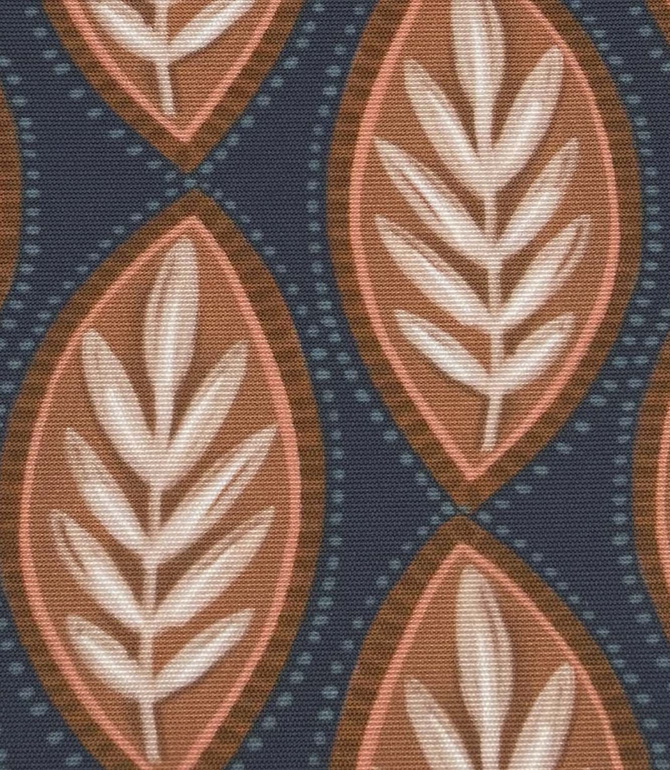 Close-up of Amber Canopy outdoor fabric featuring terracotta and blush foliage motifs on a deep navy textured background.