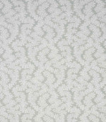 Detailed view of contemporary foliage upholstery fabric in muted sage and ivory tones, showing an intricate leaf design and natural woven texture.