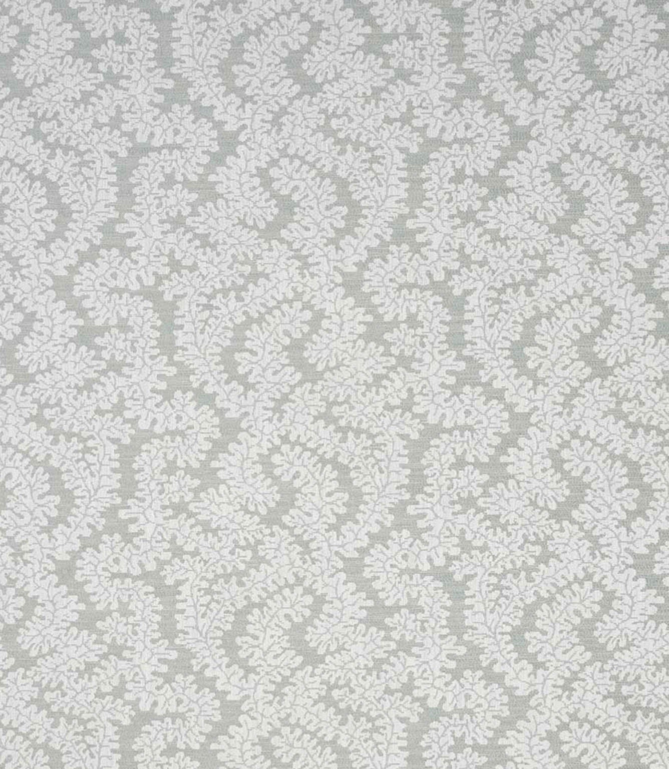 Detailed view of contemporary foliage upholstery fabric in muted sage and ivory tones, showing an intricate leaf design and natural woven texture.