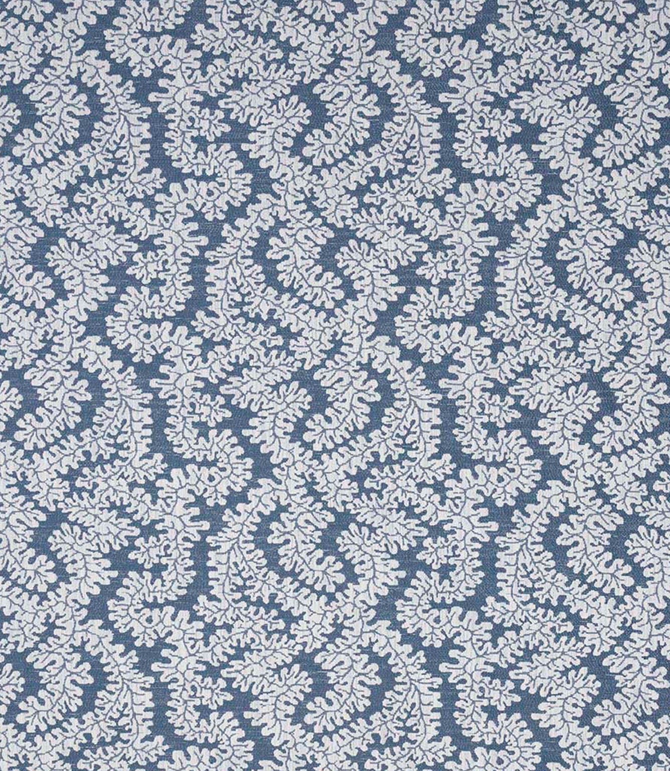 Detailed view of contemporary foliage upholstery fabric in muted blue and ivory tones, showing a natural woven texture and intricate leaf design.