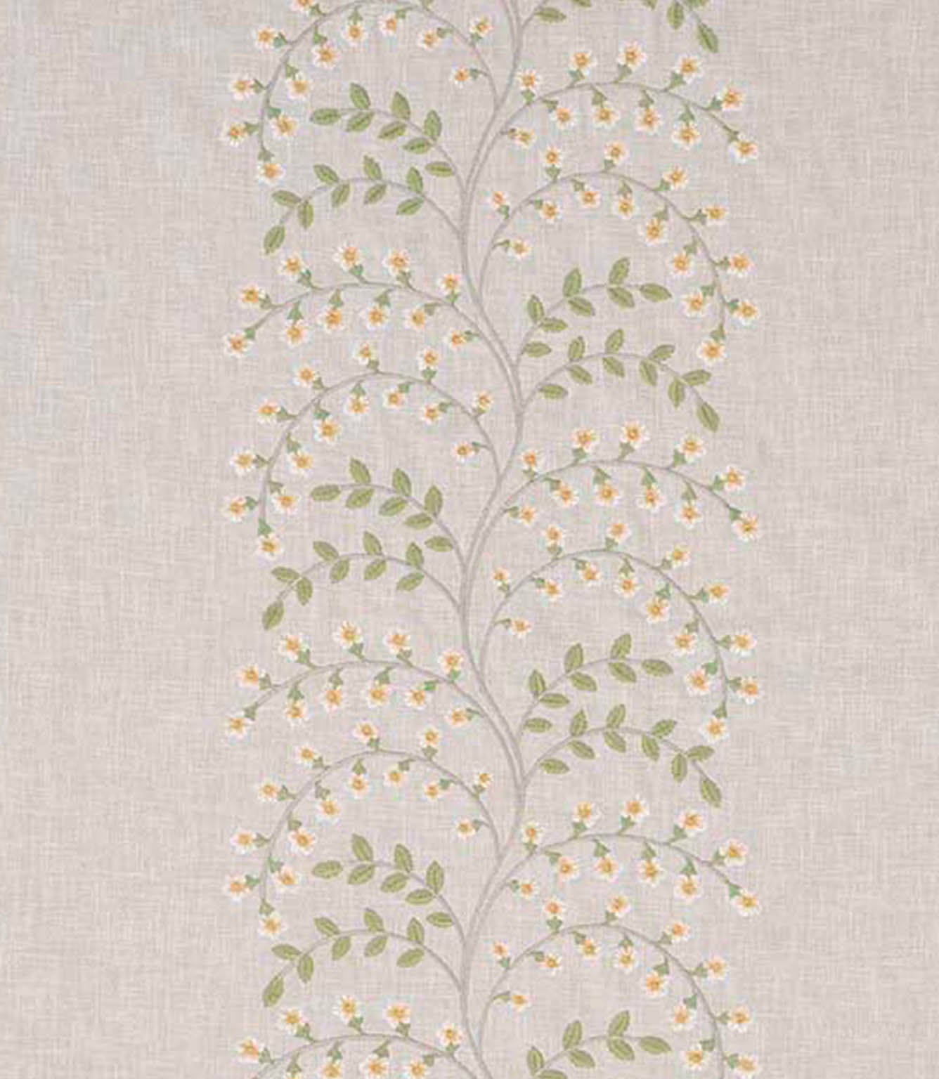 Close-up of designer embroidered fabric showing delicate vine pattern with small yellow flowers and light green leaves on a natural beige textured ground.
