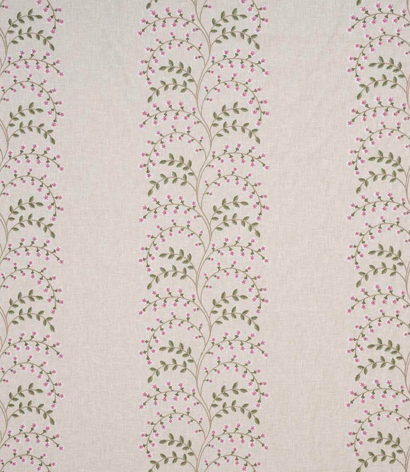 Wide view of embroidered floral fabric with repeating vertical trails of pink blossoms and green foliage set against a soft neutral background, highlighting pattern spacing and flow.