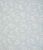 Upholstery fabric with a contemporary embroidered leaf design in soft pale blue on a light neutral background.