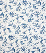 Upholstery fabric with a contemporary embroidered leaf pattern in shades of blue on a soft off-white background.