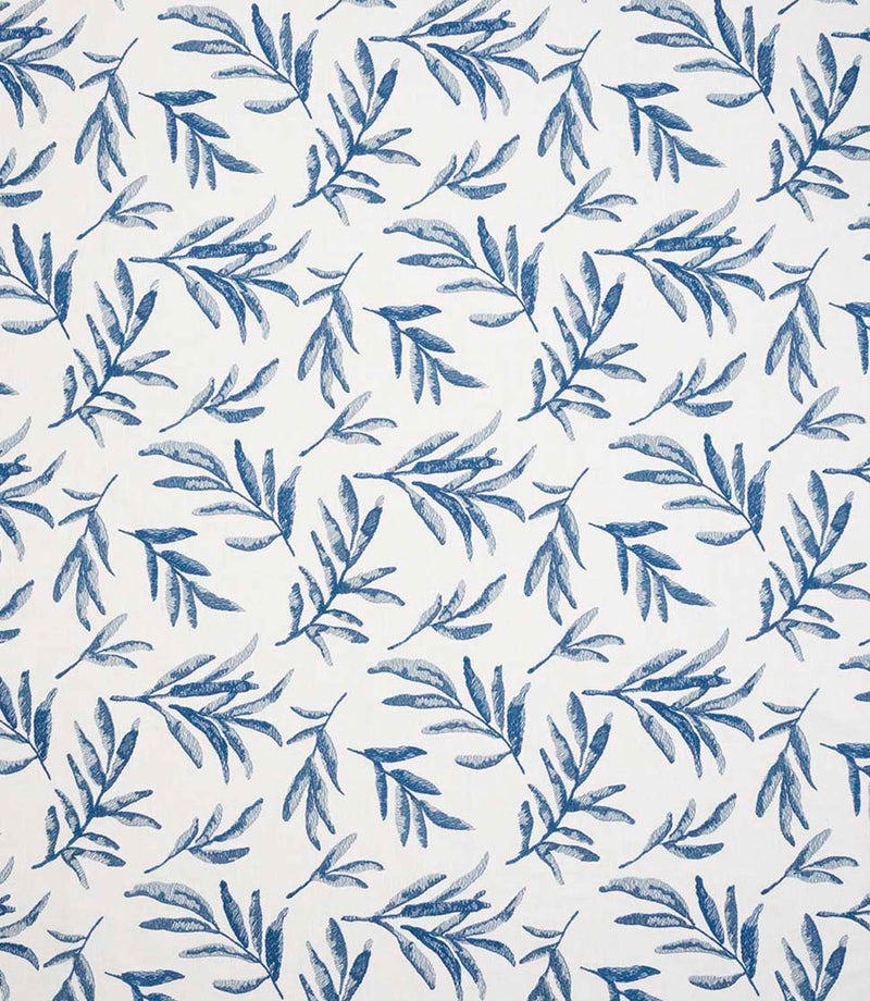 Upholstery fabric with a contemporary embroidered leaf pattern in shades of blue on a soft off-white background.