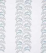 Embroidered floral trail fabric with delicate vine pattern in soft blue-green and pale grey tones on a light ivory background, showing vertical repeat and fine stitched detailing.
