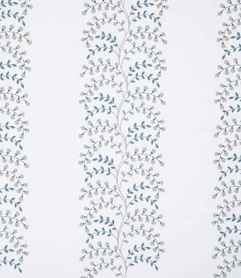 Embroidered floral trail fabric with delicate vine pattern in soft blue-green and pale grey tones on a light ivory background, showing vertical repeat and fine stitched detailing.