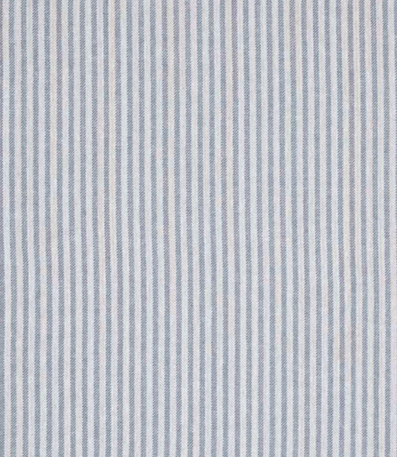 Woven ticking stripe fabric with fine vertical lines in soft blue and neutral tones, set against a light background with a subtle herringbone texture and a calm, tailored appearance.