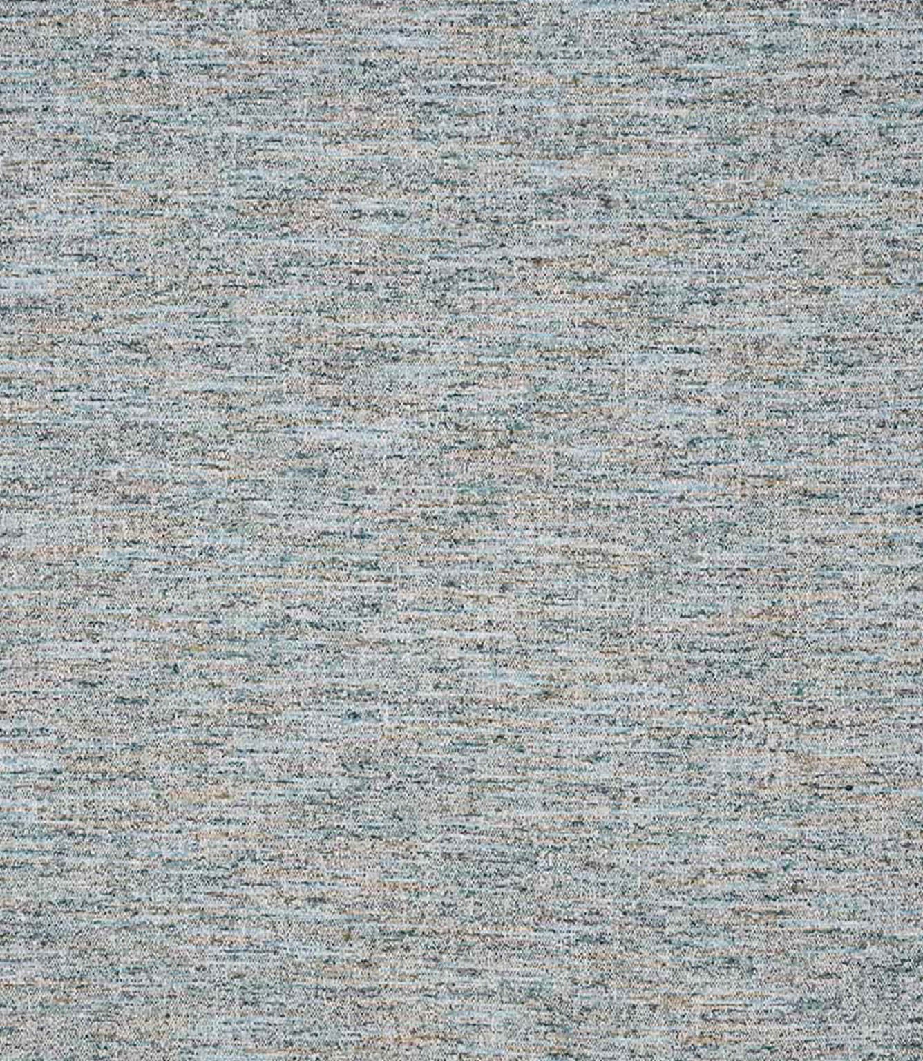 Detailed view of textured woven upholstery fabric showing a layered linear pattern with interwoven soft blue, neutral and warm flecks for added depth.