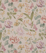 All-over floral designer fabric featuring trailing stems and blossoms in soft pink, muted red, and yellow hues with green leaves on a warm beige ground.