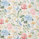 All-over floral designer fabric with trailing stems and blossoms in blue, pink and yellow, complemented by green leaves on an ivory ground.