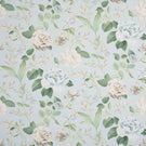 All-over floral designer fabric with trailing foliage in muted blue and green shades set against a light blue ground.