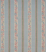 Repeating striped designer fabric with delicate ditsy floral detailing in blue, red, and green, arranged in vertical bands across a pale blue ground.
