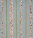 Repeating striped designer fabric with delicate ditsy floral detailing in blue, red, and green, arranged in vertical bands across a pale blue ground.