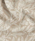 Close-up of Morris & Co Acorn sheer fabric in cream and beige, showing the lightweight open weave and detailed William Morris acorn and foliage design.