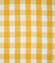 Full pattern view of Aldsworth Check Ochre fabric featuring evenly spaced ochre yellow and white gingham checks with a subtle woven texture.