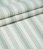 Aldsworth Stripe Mint fabric loosely draped in soft folds, showcasing the traditional green and white striped design and natural woven texture.