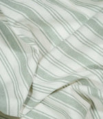 Detailed close-up of Aldsworth Stripe Mint fabric gathered into soft folds, highlighting the subtle mint green ticking stripes and textured surface.