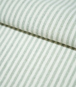 Folded Aldsworth Ticking Mint fabric showing classic mint green and white ticking stripes, with a visible woven texture and soft muted colouring.