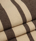 Neutral striped upholstery fabric in brown and natural tones with a textured woven surface.