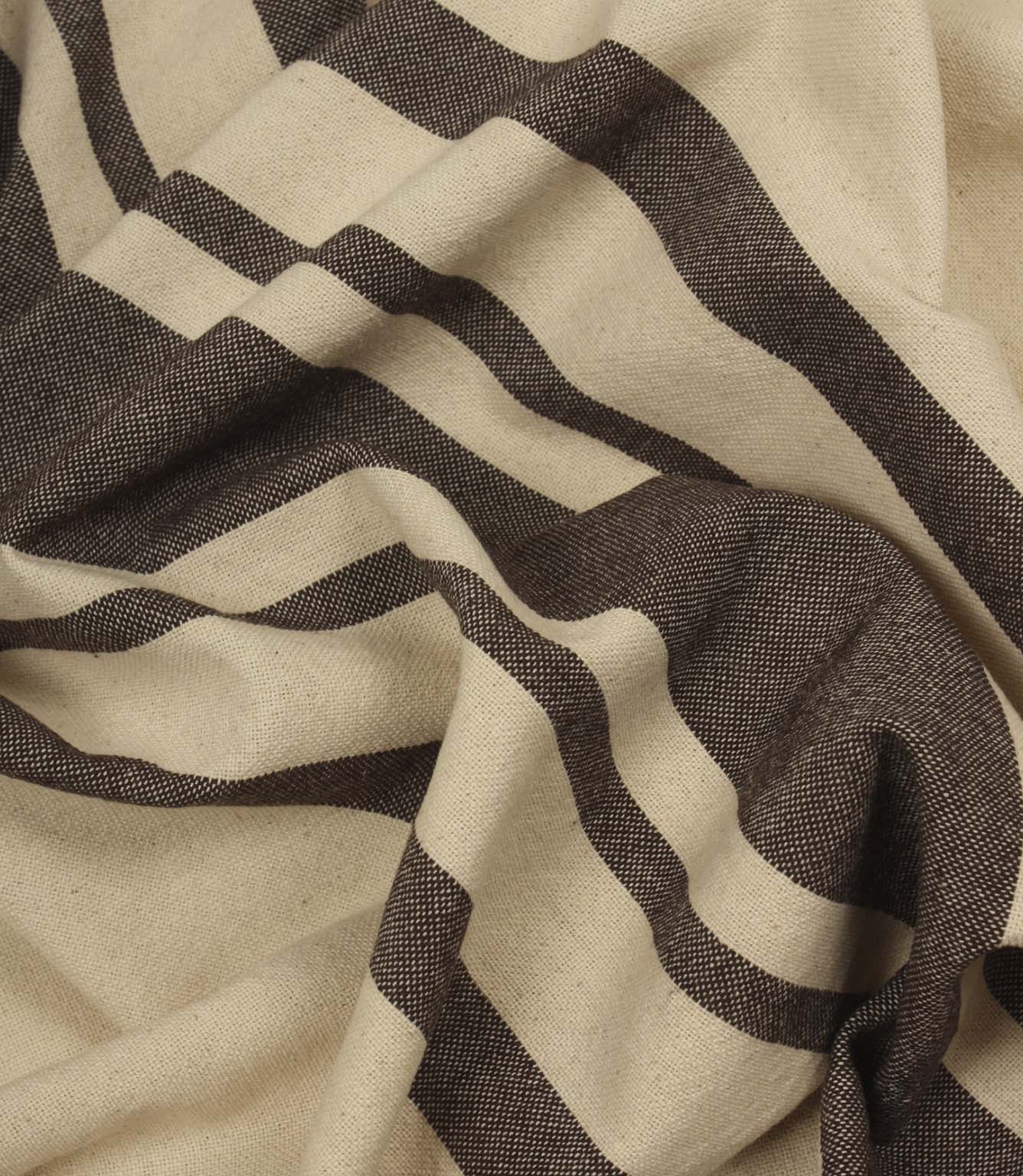 Softly draped brown stripe fabric with wide and narrow stripe detailing on a natural background.