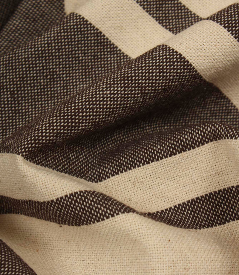 Detailed close-up of woven brown stripe fabric highlighting the textured weave and rich contrast.