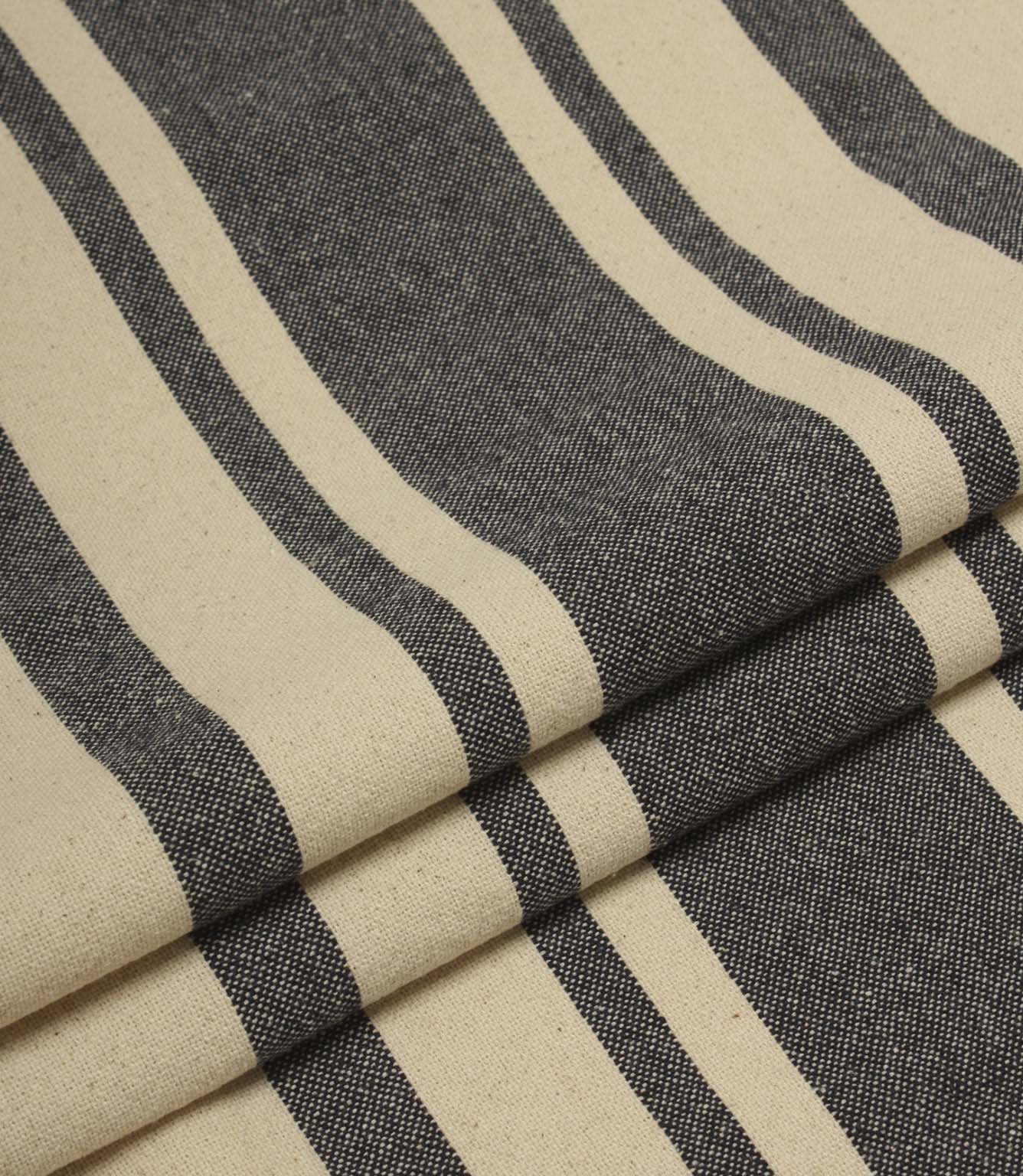Folded charcoal grey and natural striped fabric with a soft drape and durable woven texture.