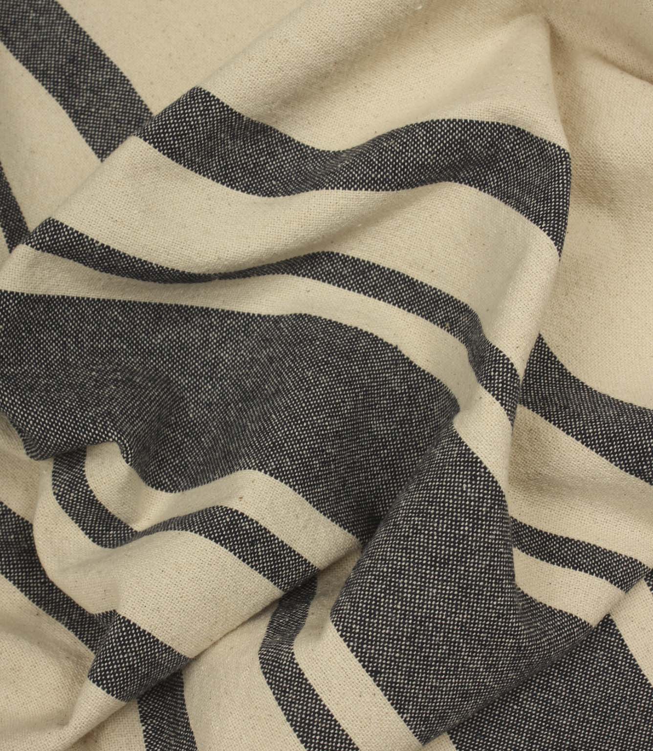 Softly draped charcoal stripe fabric featuring wide and narrow stripes on a natural background.