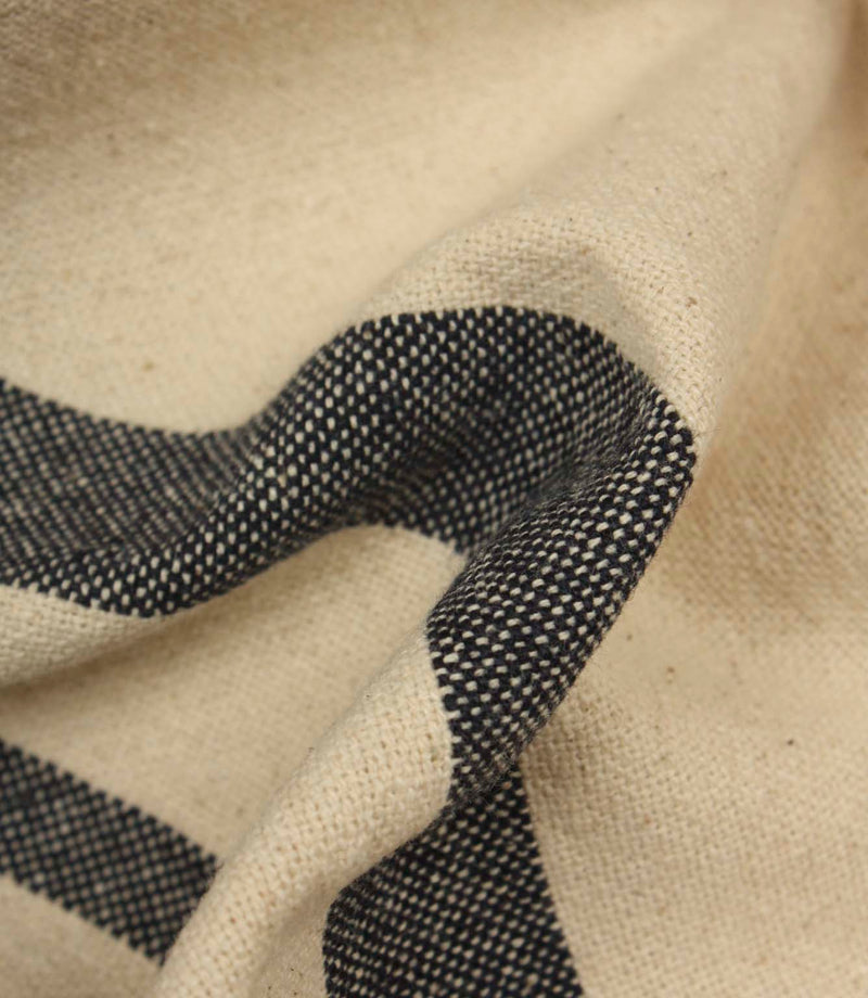 Detailed close-up of woven charcoal stripe fabric highlighting the textured weave and contrast.