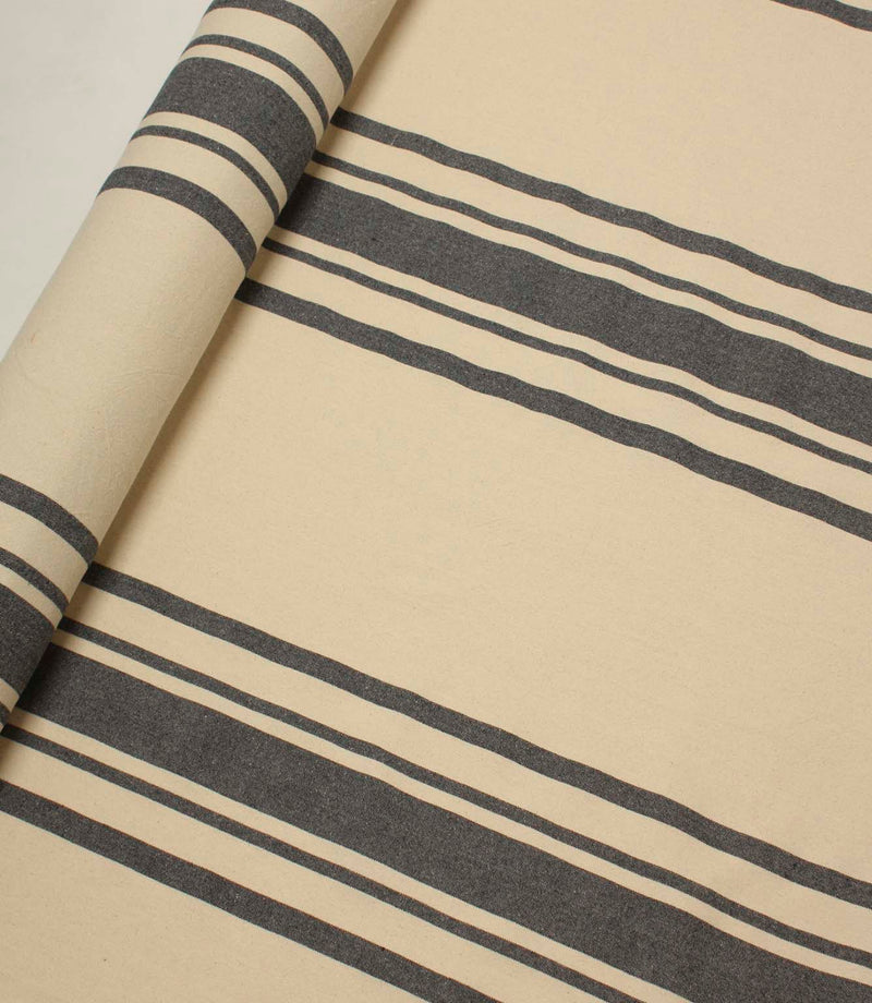 Charcoal and cream striped fabric roll with bold stripe detailing, suitable for upholstery, curtains and interior décor projects.