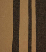 Close-up of black and camel striped woven fabric highlighting the detailed weave and contrasting stripe design.