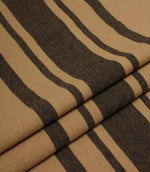 Folded black and camel striped fabric with a soft drape and durable woven finish.