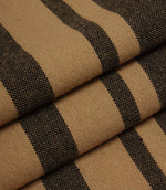 Neutral striped upholstery fabric in camel and black tones with a textured woven surface.