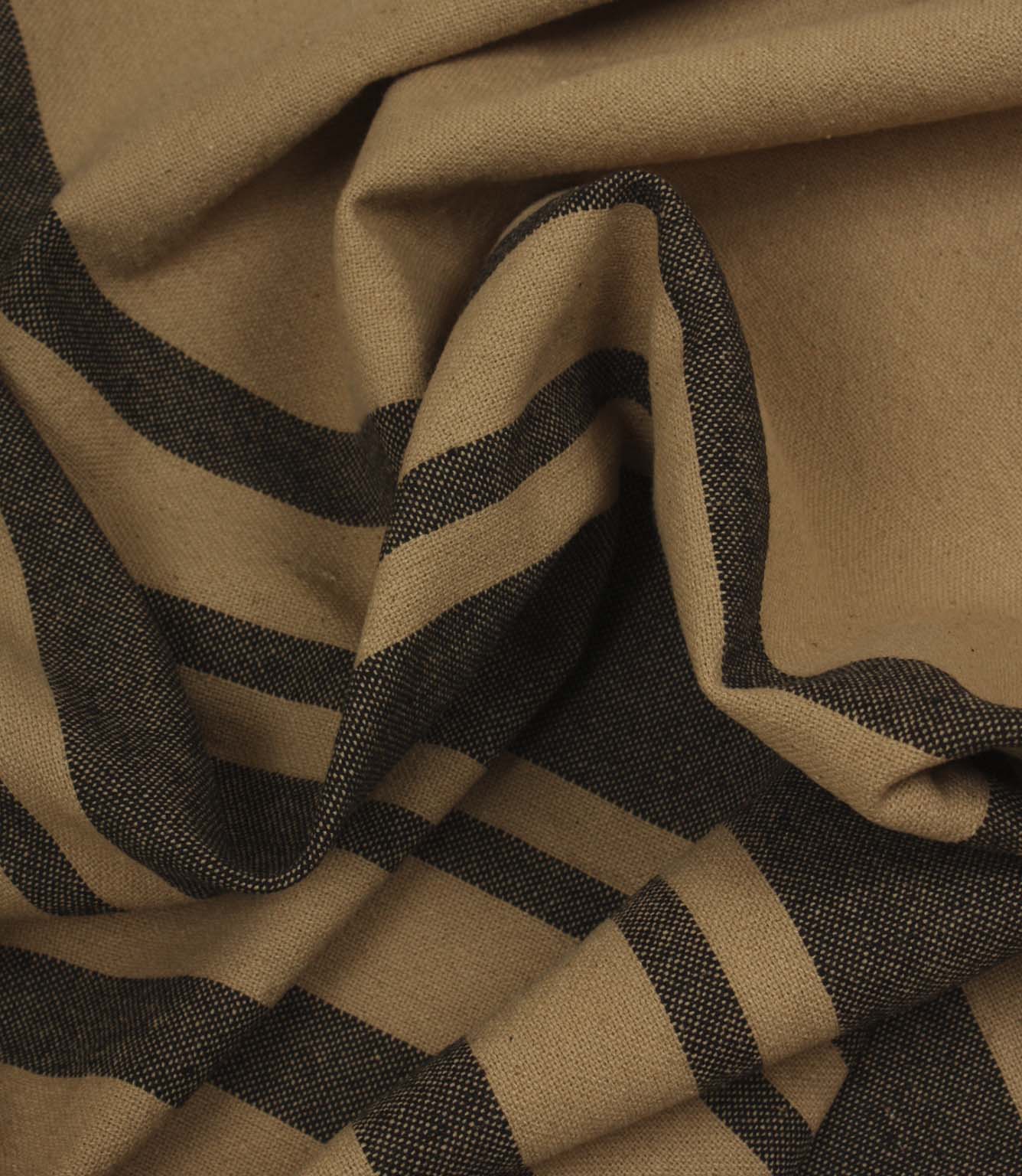 Softly draped black stripe fabric featuring bold and narrow stripes on a warm camel background.