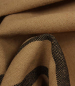Detailed close-up of woven black stripe fabric showing the textured weave and rich contrast.