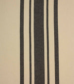 Cream and black striped woven fabric with bold vertical stripes, suitable for curtains, upholstery and soft furnishing projects.