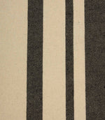 Close-up of cream striped fabric with contrasting black woven stripes and a textured natural-look finish.